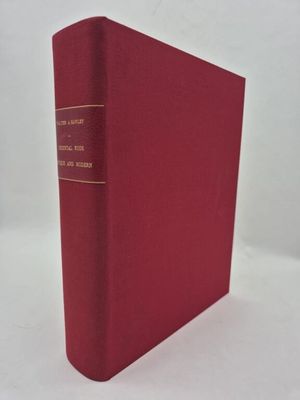 un livre rouge posé sur une surface blanche