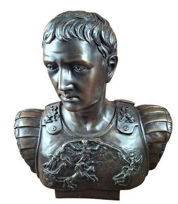 bronze bust of a young man wearing armor and holding a shield