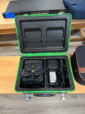 a green case that is open on a table