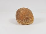 a piece of bread that is sitting on a white surface