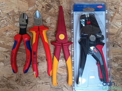 three pliers and a pair of pliers in a package