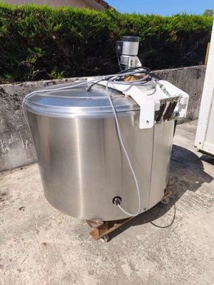 an image of a stainless steel tank sitting on top of a wooden pallet