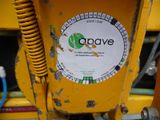 a close up of a yellow machine with a sticker on it