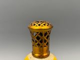 a yellow vase that is sitting on a table