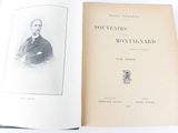 an open book with a picture of a man in a suit and tie