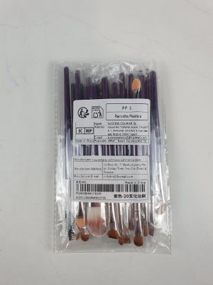un paquet de stylos violets posé sur une table blanche