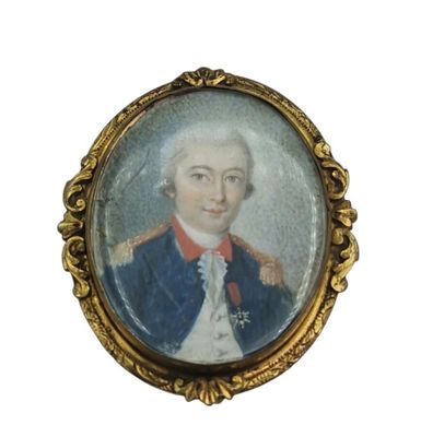une vieille photo d'un homme en costume bleu et cravate rouge