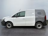 a white van parked in a parking lot on a cloudy day