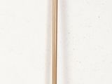 a metal pole with a wooden handle on a white wall