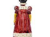 a figurine of a woman in a red dress