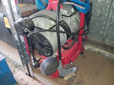 a small engine that is sitting in a garage