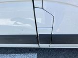 a close up of a door handle on a white car