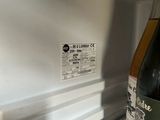 a bottle of wine that is sitting in the refrigerator
