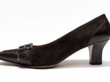 a close up of a woman ' s shoe on a white background