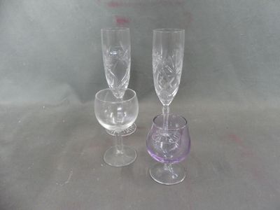 two wine glasses sitting next to each other on a table