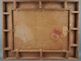 an old wooden box with a piece of paper on top of it
