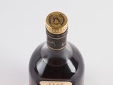 a bottle of liquor that is sitting on a table