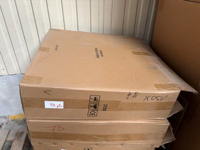 a stack of boxes sitting on a pallet in a warehouse