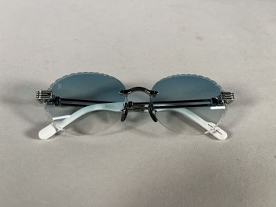 the glasses are made of plastic and have a metal frame