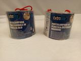 two cans of paint sitting on top of a white table