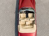 aerial view of a red car parked on the side of the road
