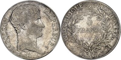 a silver coin with an image of a man ' s head on it