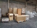 boxes and pallets are stacked on pallets in a warehouse
