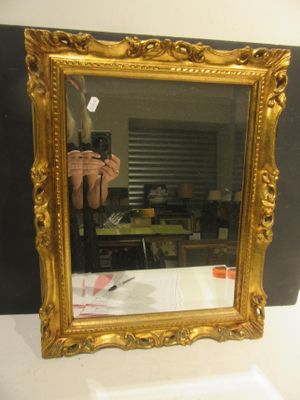 a person taking a picture of themselves in a mirror