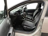 the interior of a car with the door open and the driver ' s seat down