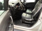 the interior of a car with the driver ' s seat folded down