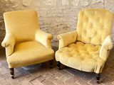 pair of yellow chairs sitting next to each other on a brick floor