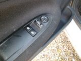 a close up of a car door handle with a remote control