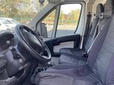 the interior of a van with two seats and a steering wheel