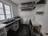 a kitchen with a sink and a window in it