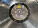a record with a label on it sitting on a table