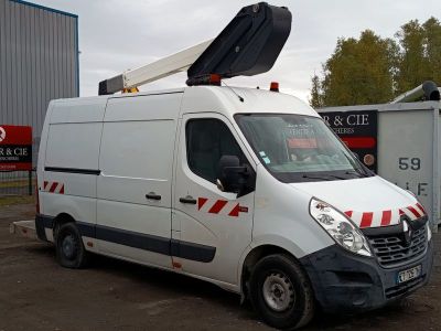 a white van parked in a parking lot with a crane on top of it