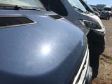 cars parked in a parking lot in a lot with a sky background