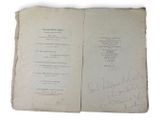 a book with some writing on it with a pen and ink