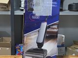 the box of the mop is sitting on the table next to the box