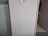a white refrigerator with a number on it in a kitchen