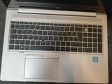 a laptop computer sitting on top of a table