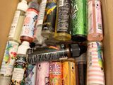 a cardboard box filled with assorted crafting supplies