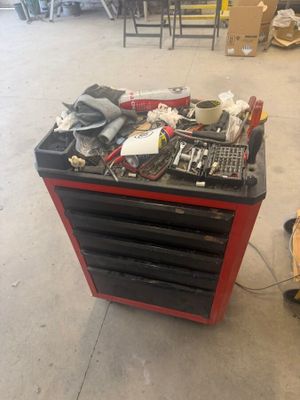 a workbench with tools on it in a garage