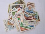 a pile of postage stamps sitting on a table