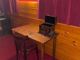 a small table with a laptop on it in a room