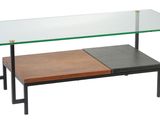 a coffee table with a glass top and metal legs