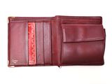 leather wallet with a red card holder on top of it