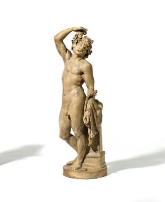 two statues of a man and a woman standing next to each other