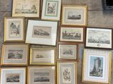 a lot of framed pictures on the floor of this room