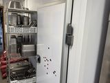 a kitchen with a refrigerator, dishwasher, and dishwasher in it